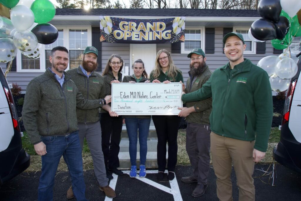 Brody Brothers team presenting a donation check to Eden Mill Nature Center (Harford County, MD) in honor of their new Bel Air office opening.