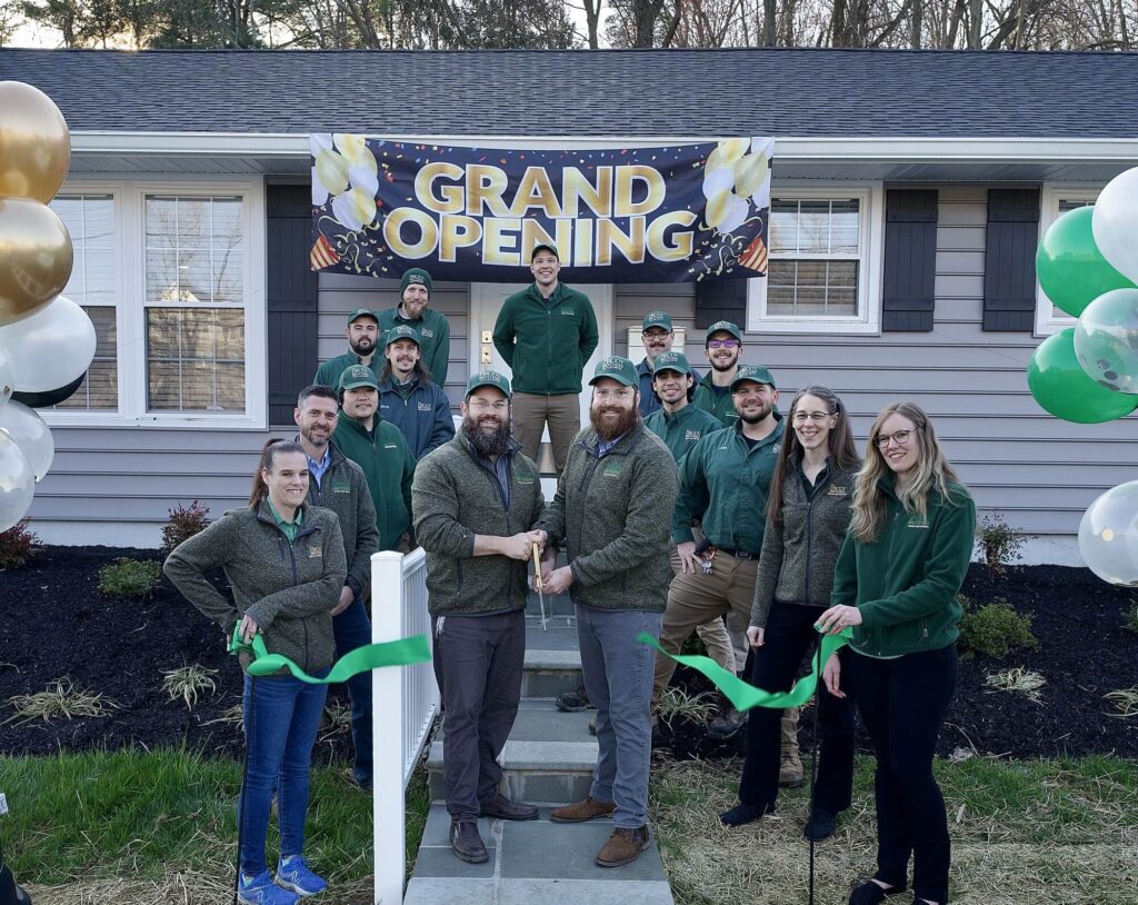 Brody Brothers Pest Control team celebrating with a ribbon cutting ceremony at their new office in Bel Air, Maryland.